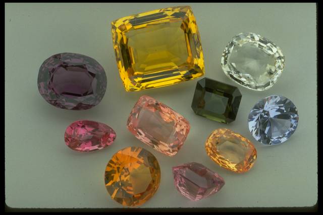 Photograph of a group of sapphires from the National Gem Collection showing color variation